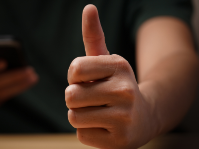 A satisfied Erectimus customer giving the thumbs up sign