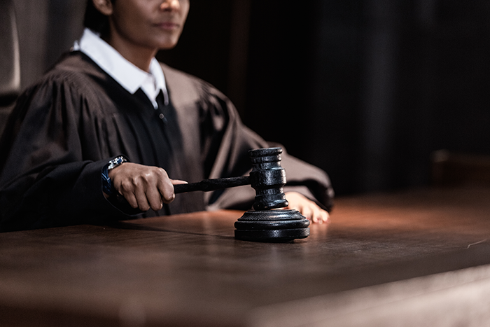 Image of judge slamming down a gavel for the Erectimus Terms of Service page