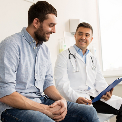 Doctor advising patient to take Erectimus for his erectile issues