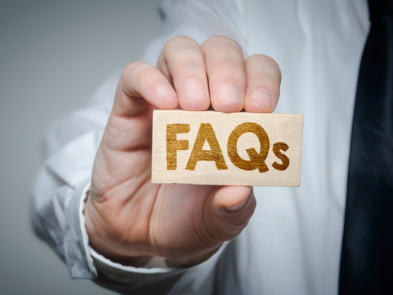 Doctor holding an FAQ block