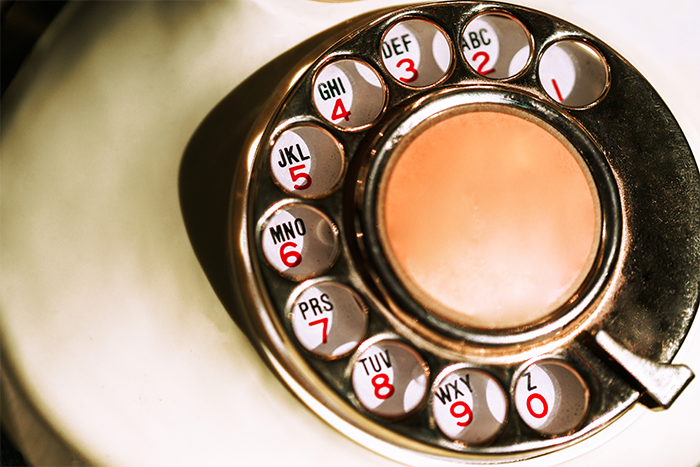 The Erectimus Contact Page image of a rotary dial phone