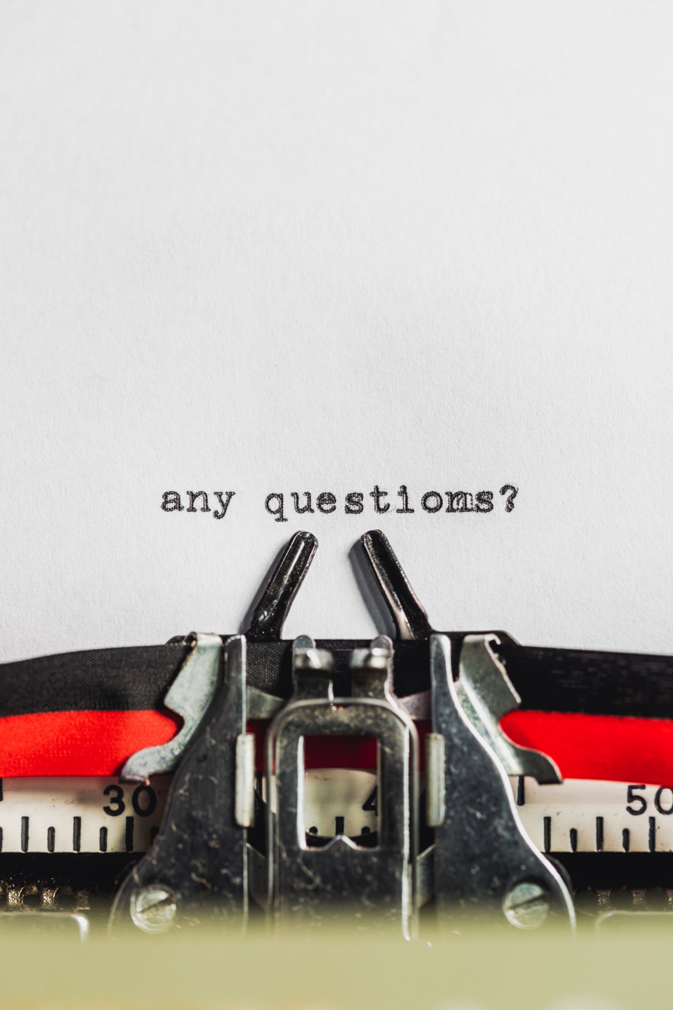 Erectimus FAQ image of text on typewriter asking any questions